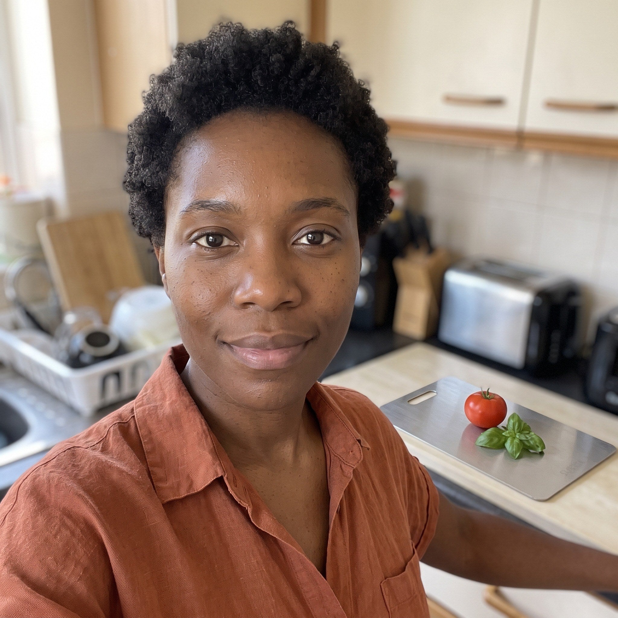 Olivia taking a selfie beside her kitchen board